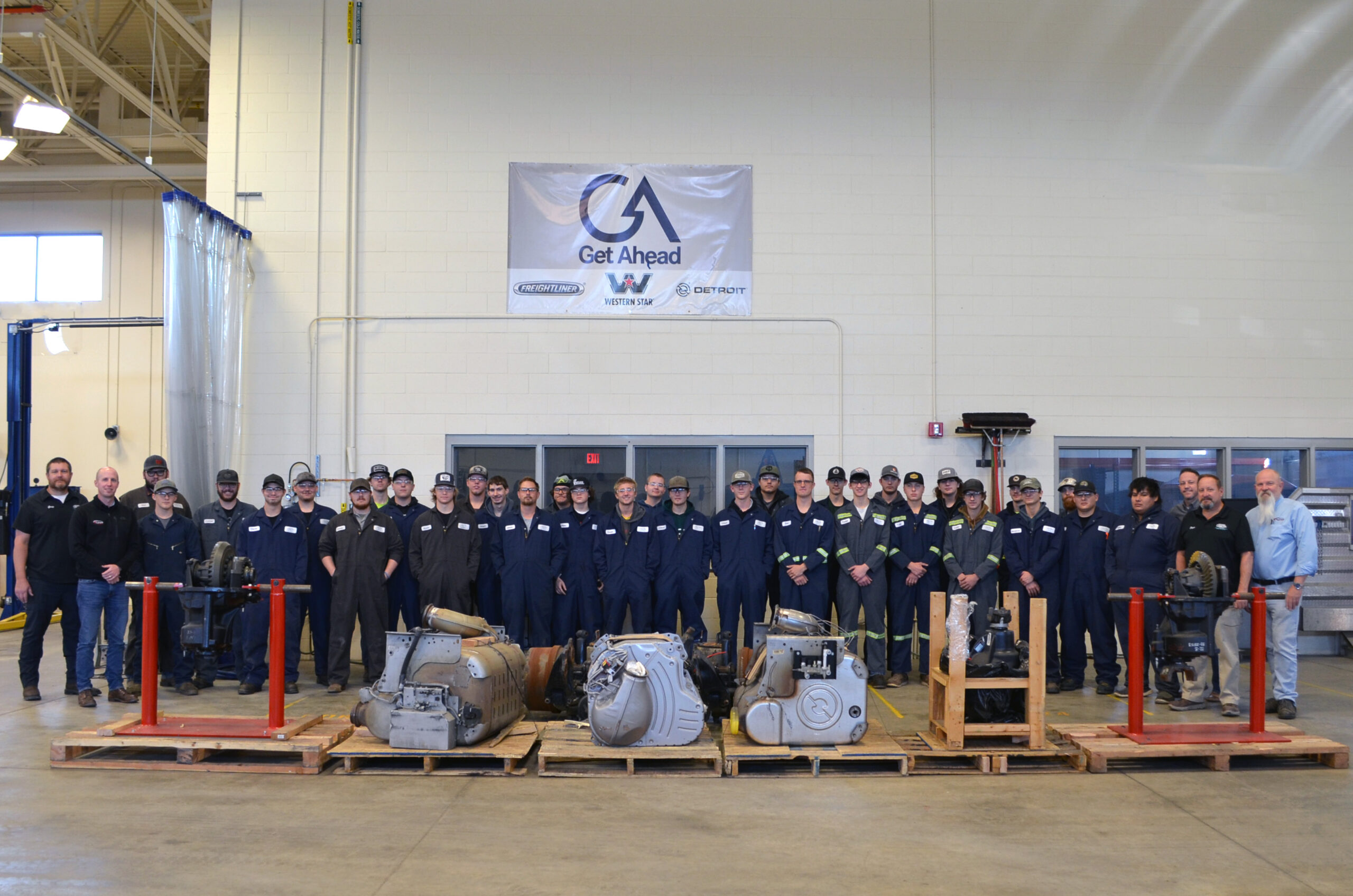 Diesel Tech students pose with class instructors and Floyd's staff among donated materials.