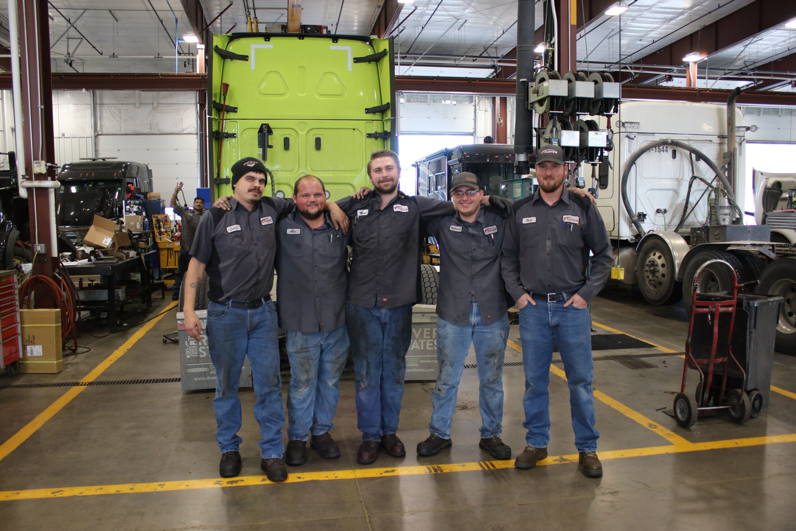 Several Floyd's Technicians who are WDTC Alumni pose for photo